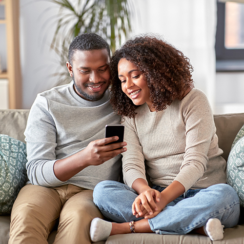 A couple looking at a mobile phone